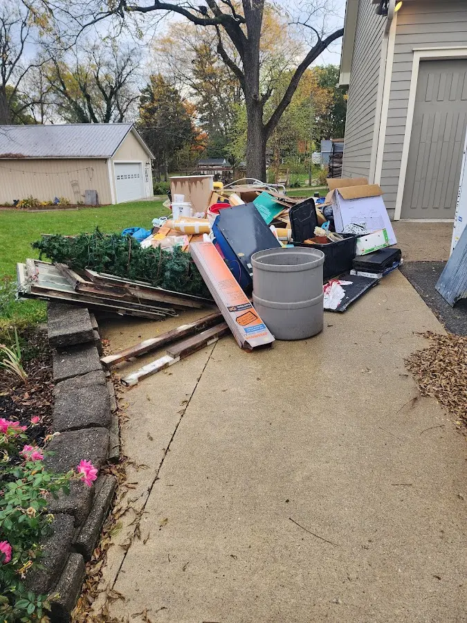 Dumpster being loaded with debris for Roofing Dumpster Rental in Bonita
